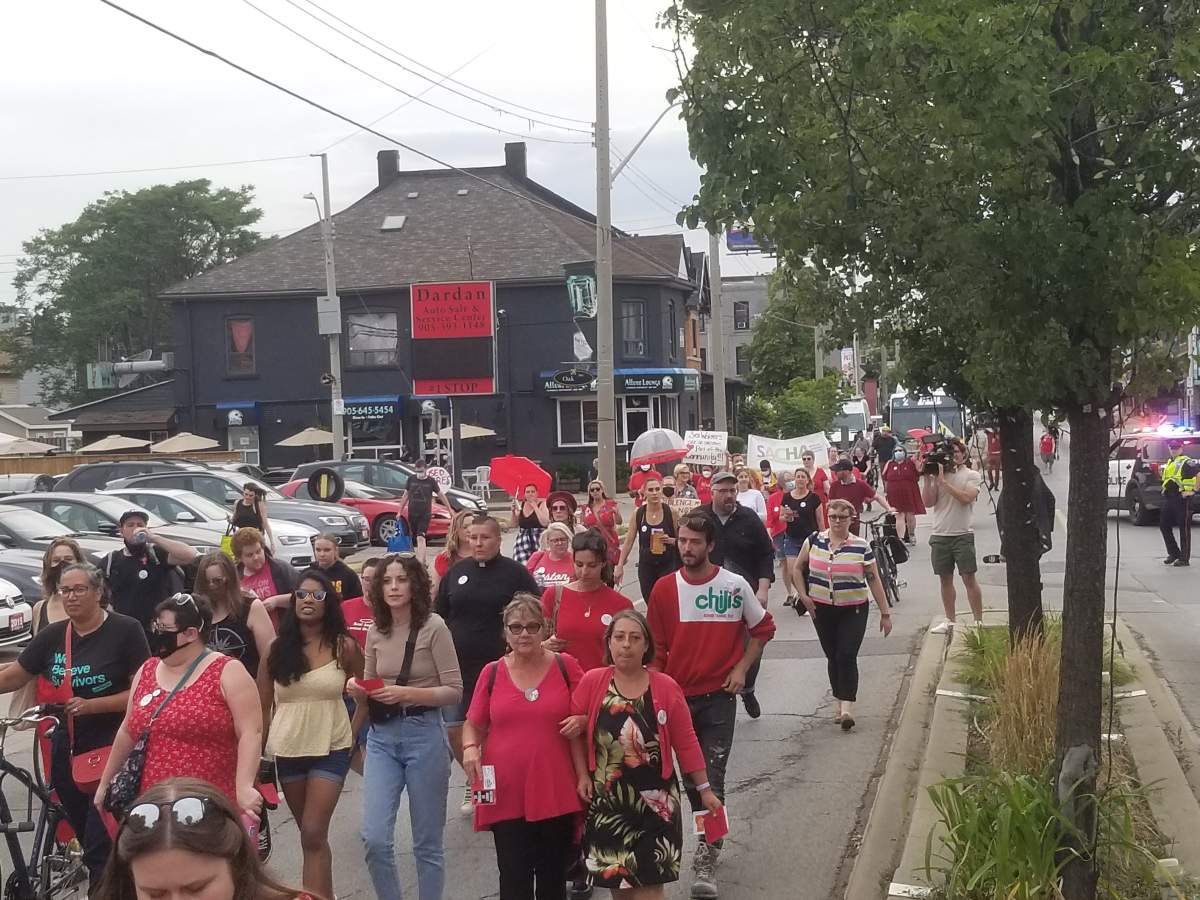 vigil attendees march to SWAP Hamilton