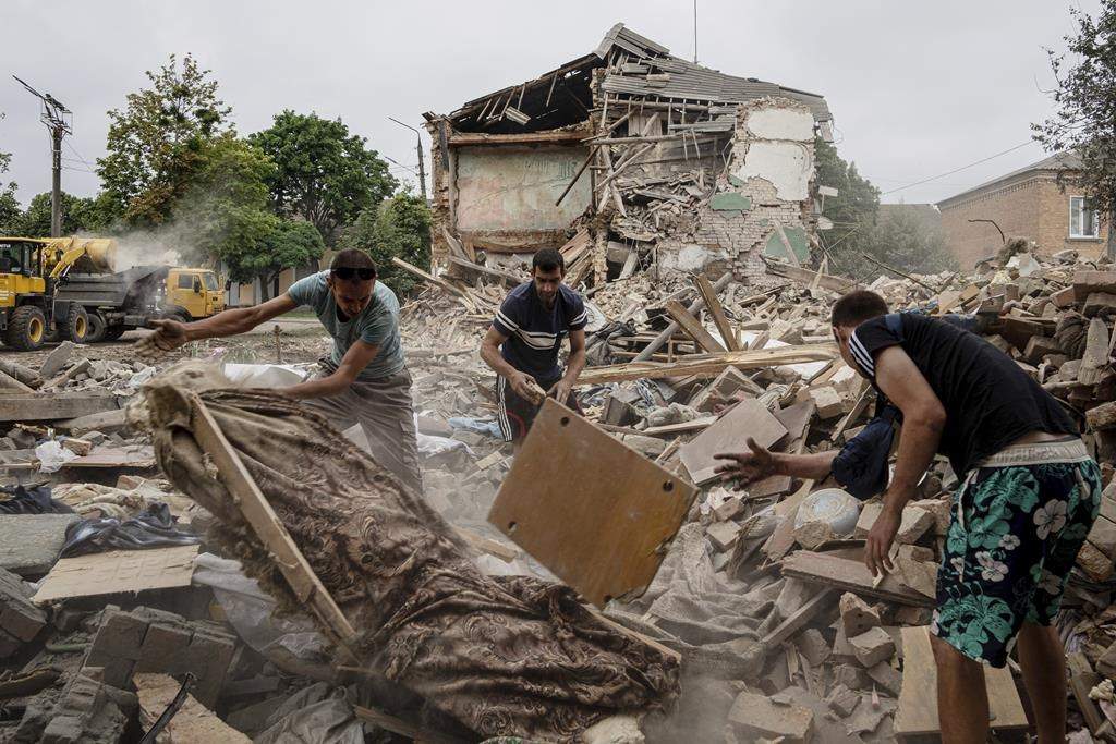 Debris of destroyed apartment following Russian shelling in a residential area in Chuhuiv, Kharkiv region, Ukraine, Saturday, July 16, 2022. (AP Photo/Evgeniy Maloletka)
