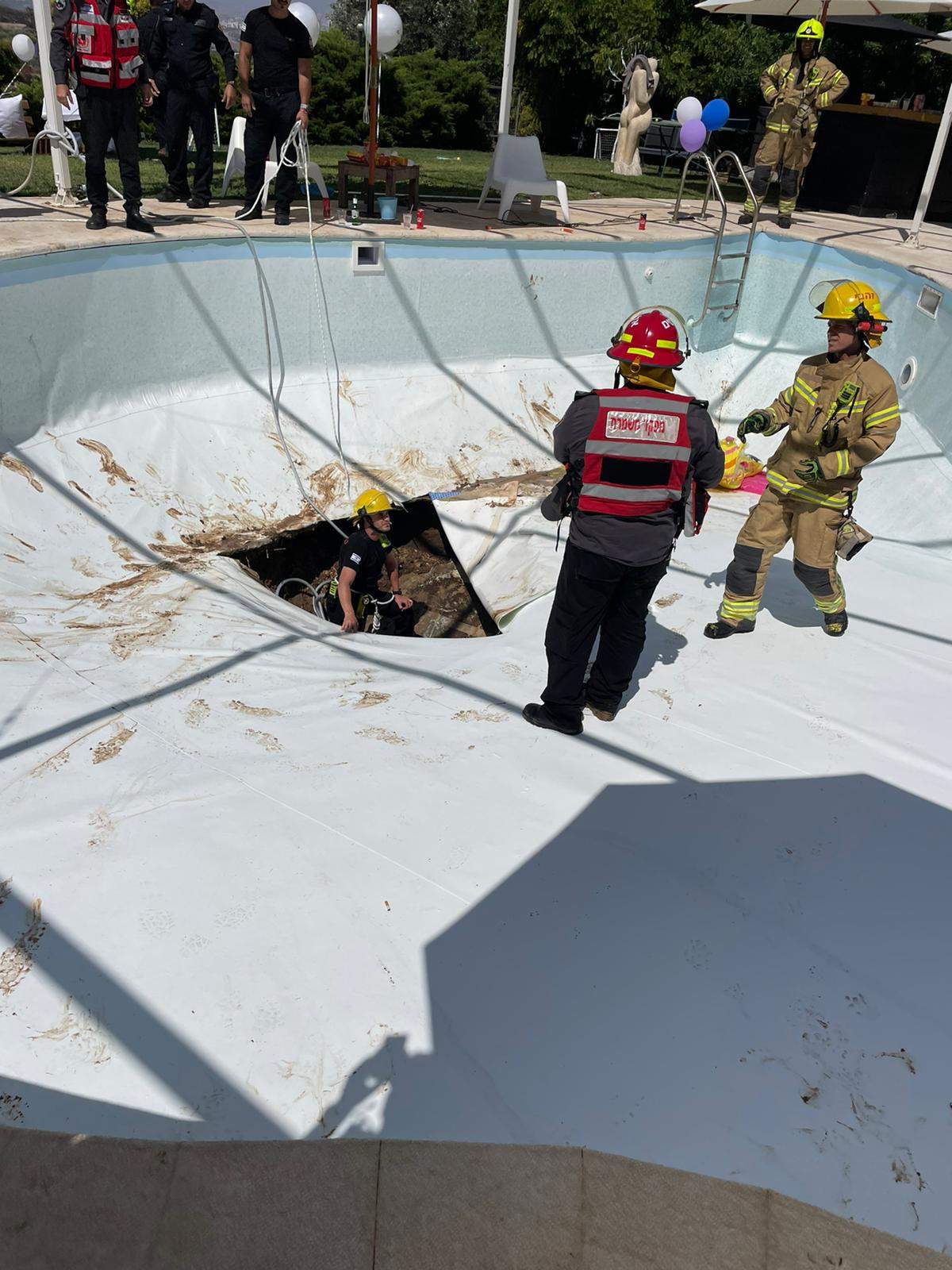 The sinkhole that opened underneath an in-ground pool in Israel on Thursday.