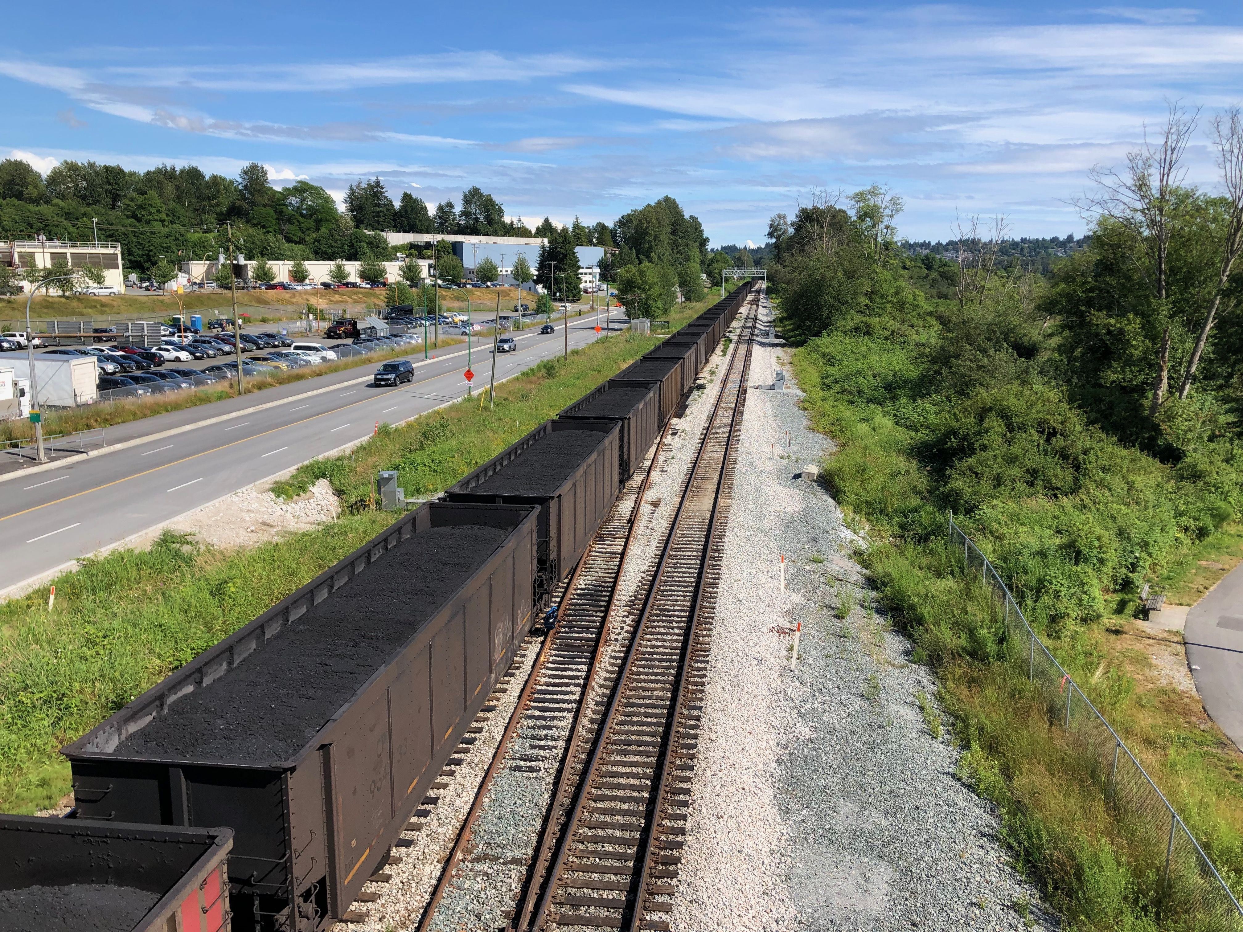 Cars full of coal sit on the rails in Burnaby, BC. The province still exports millions of tonnes of coal overseas each year.
