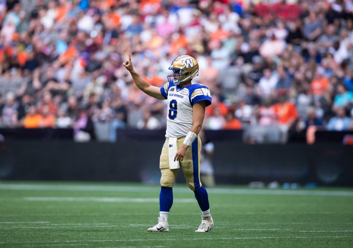 Winnipeg Blue Bombers quarterback Zach Collaros gestures to the sideline after gaining a first down against the B.C. Lions during the first half of CFL football game in Vancouver, on Saturday, July 9, 2022.