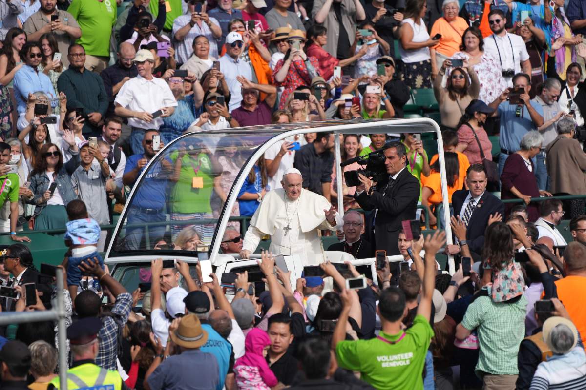 Pope Francis waves as he arrives to take part in a public mass at Commonwealth Stadium in Edmonton, Tuesday, July 26, 2022.