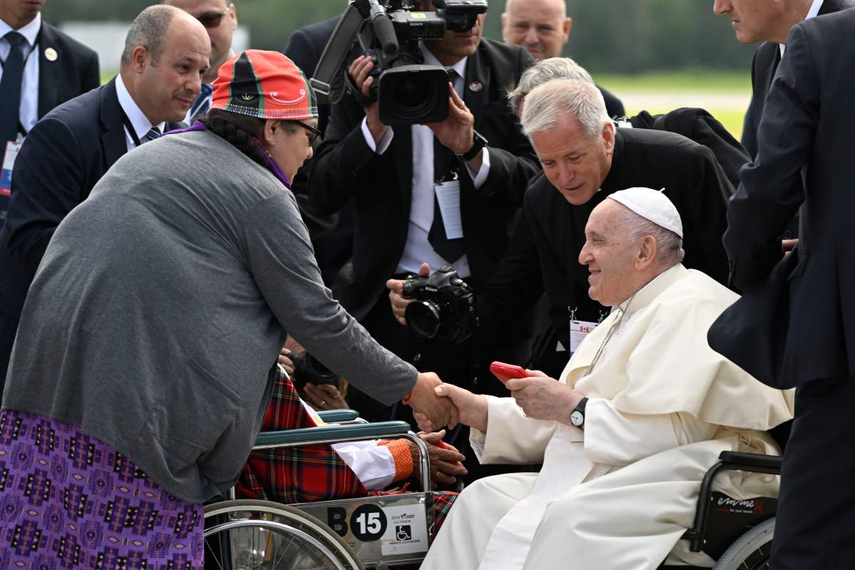Pope Francis arrives meeting survivors Elder Hélène Mollen (centre) of the Innus of Ekuanitshit and Anthonia Paul (left) of the Innus of Pessamit during his papal visit across Canada in Quebec City on Wednesday, July 27, 2022. THE CANADIAN PRESS/Bernard Brault