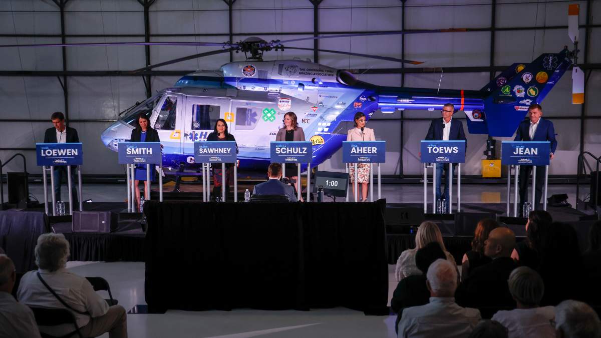 Candidates, left to right, Todd Loewen, Danielle Smith, Rajan Sawhney, Rebecca Schulz, Leela Aheer, Travis Toews, and Brian Jean, attend the United Conservative Party of Alberta leadership candidate’s debate in Medicine Hat, Alta., Wednesday, July 27, 2022.