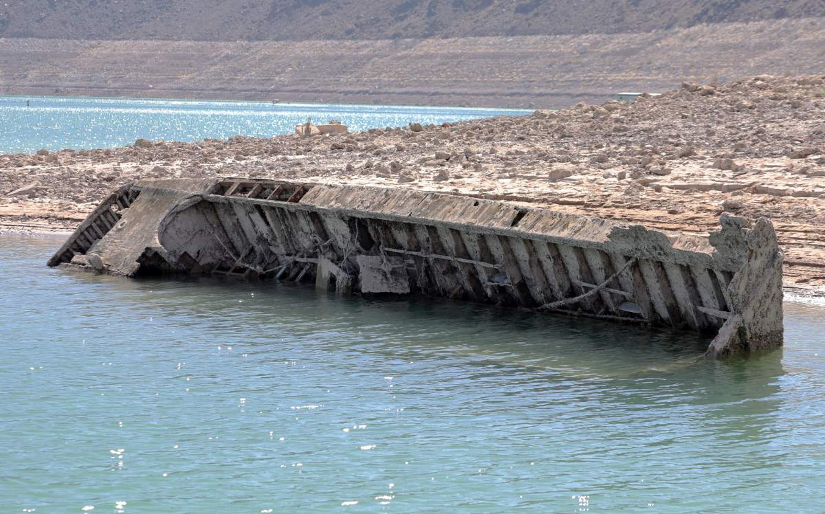 A sunken World War II-Era Higgins landing craft that used to be nearly 200 feet underwater is being revealed near the Lake Mead Marina as the waterline continues to lower on July 01, 2022 in the Lake Mead National Recreation Area, Nevada. The water level at Lake Mead is at its lowest since being filled in 1937 after the construction of the Hoover Dam as a result of a climate change-fueled megadrought coupled with increased water demands in the Southwestern United States.
