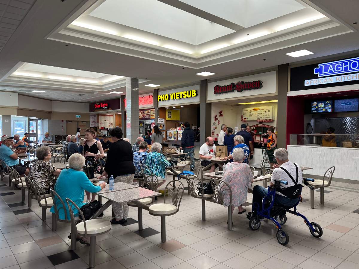 Patrons gather in the VIctoria Square Mall food court to say farewell to long time tenant Kraut Haven. Troy Charles / Global News
