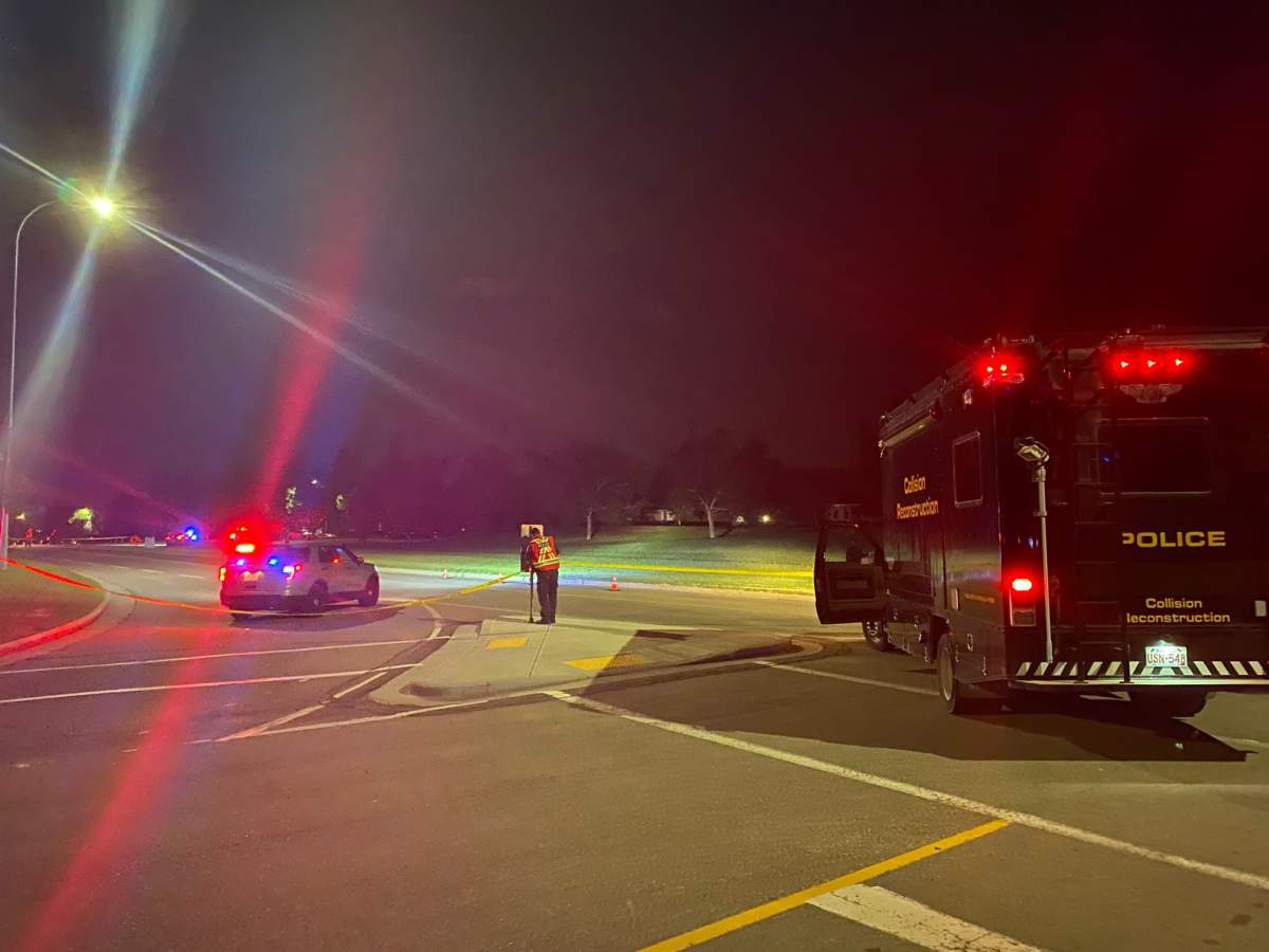 Calgary police attend the scene of a collision of a car and pedestrian in Calgary's Huntington Hills neighbourhood on July 28, 2022.