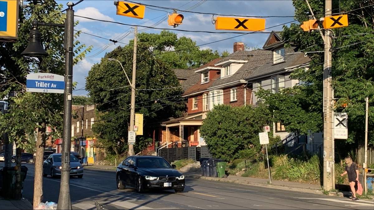 Police say a man has been taken to hospital after falling from the roof of a home in Toronto.