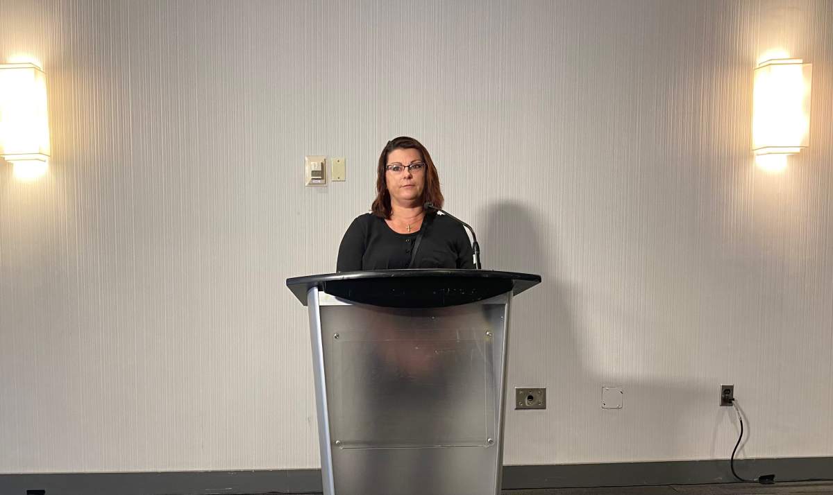 Krista Collins, the daughter-in-law of Darrell Richards, speaks at the media availability.