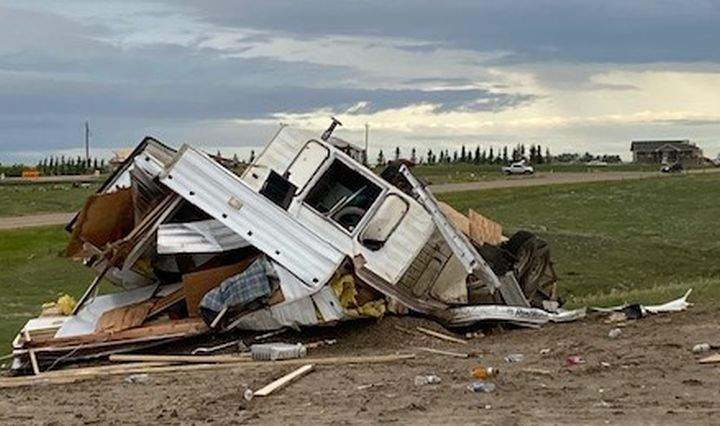 A trailer, vehicles and a home under construction were all damaged on the same property just outside Medicine Hat, Alta., on July 18, 2022 after a powerful storm tore through the area.