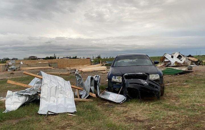 A trailer, vehicles and a home under construction were all damaged on the same property just outside Medicine Hat, Alta., on July 18, 2022 after a powerful storm tore through the area.