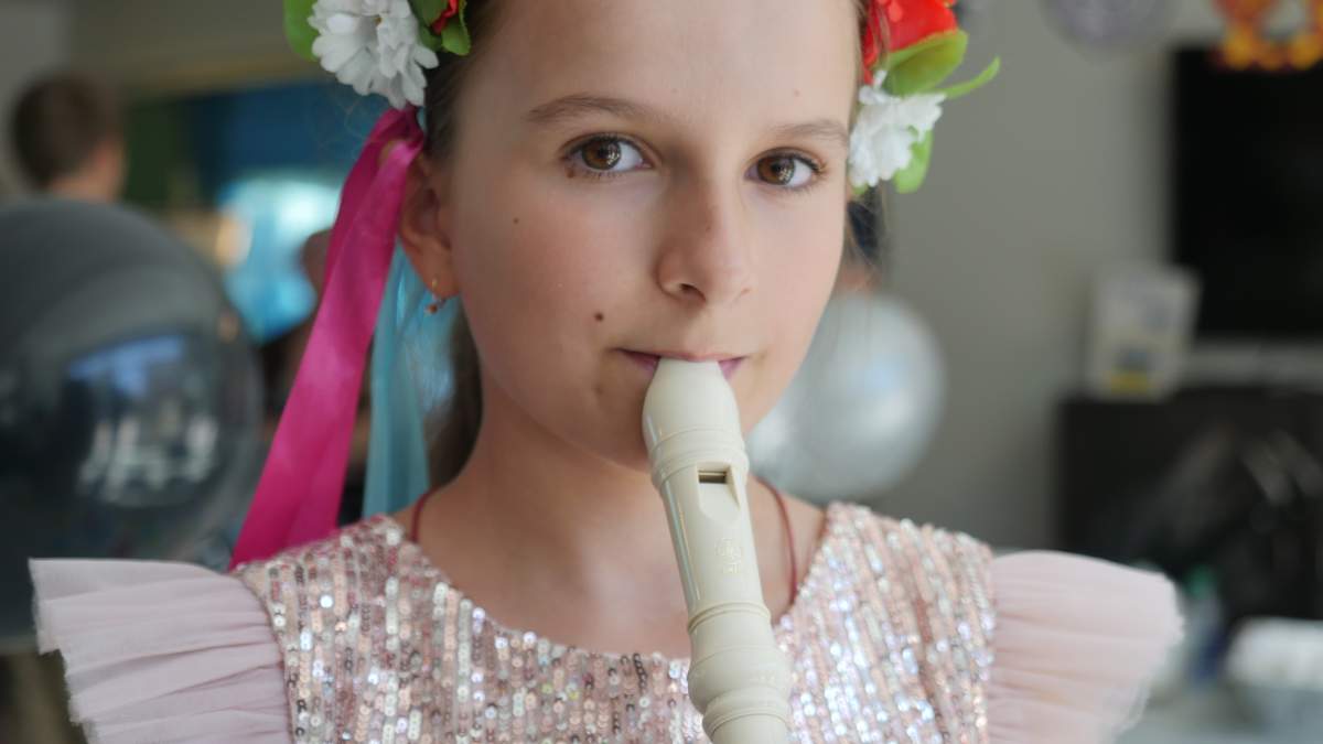 Sofiia Oleksandr playing her recorder.
