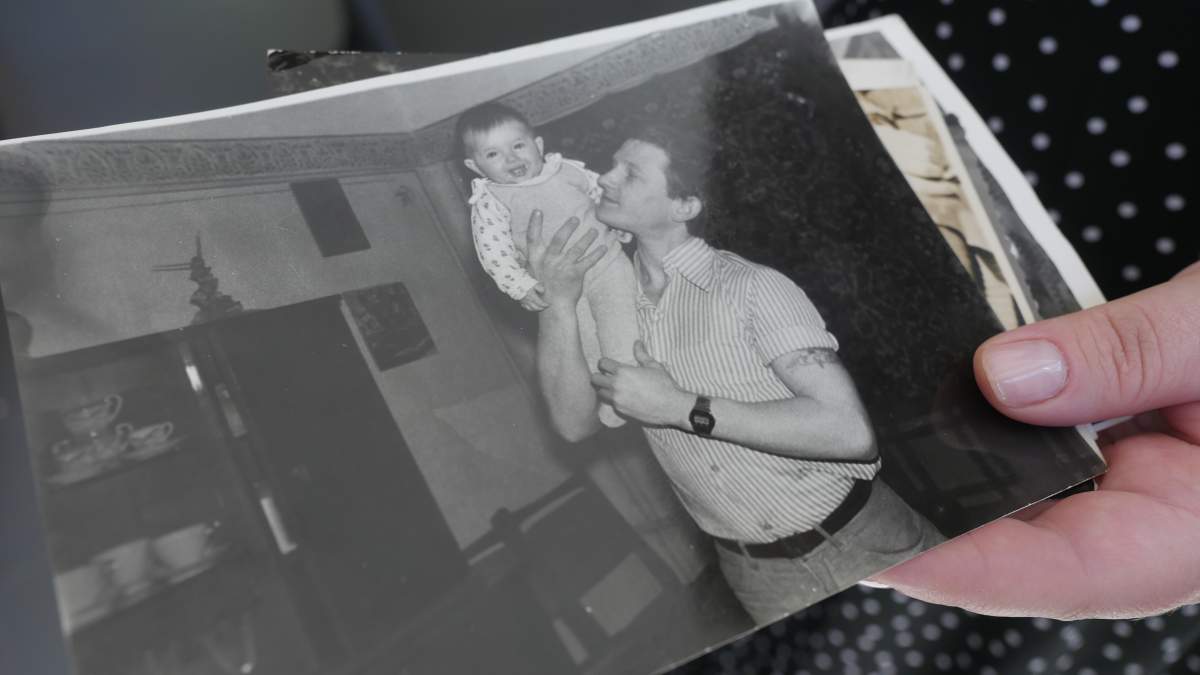 Nataliia Sydoruk’s father holding her over his shoulder when she was a baby.