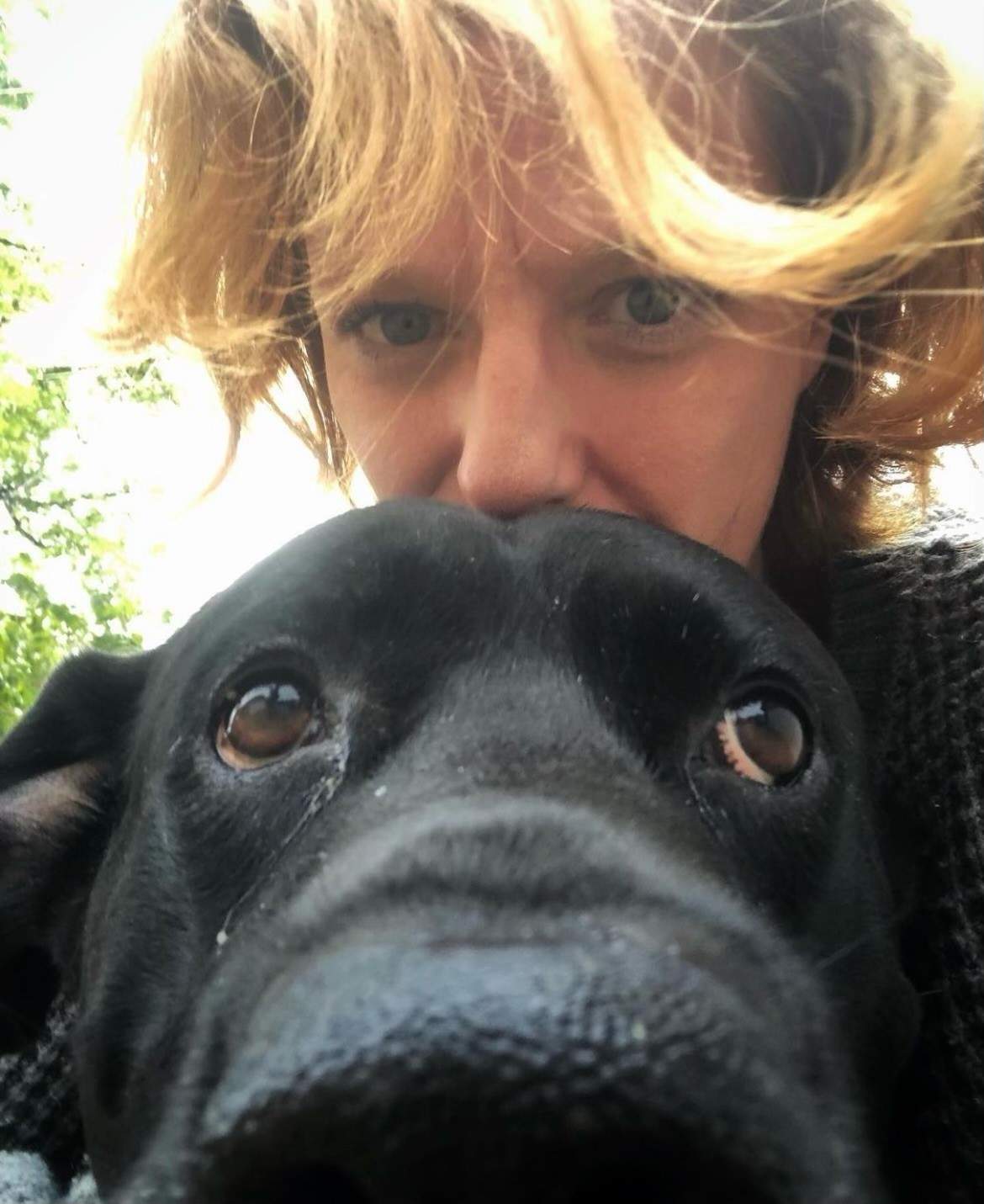 Angela Chalmers and her dog Loki. Chalmers says Loki woke her up to notify her about a strange man sleeping on her couch last month. 