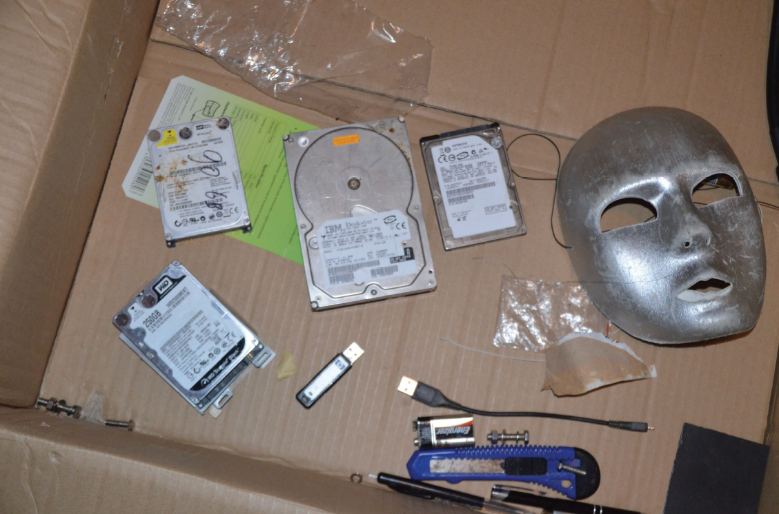 A police photo of the two hard drives seized in Aydin Coban’s cabin which Crown says contain file traces linked to the online extortionist.