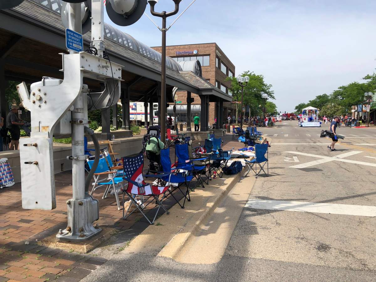 Empty chairs line a street in Highland Park, Illinois, where a shooting took place on the Fourth of July.