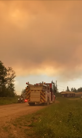 A fire truck heads toward a wildfire in Mathias Colomb Cree Nation.