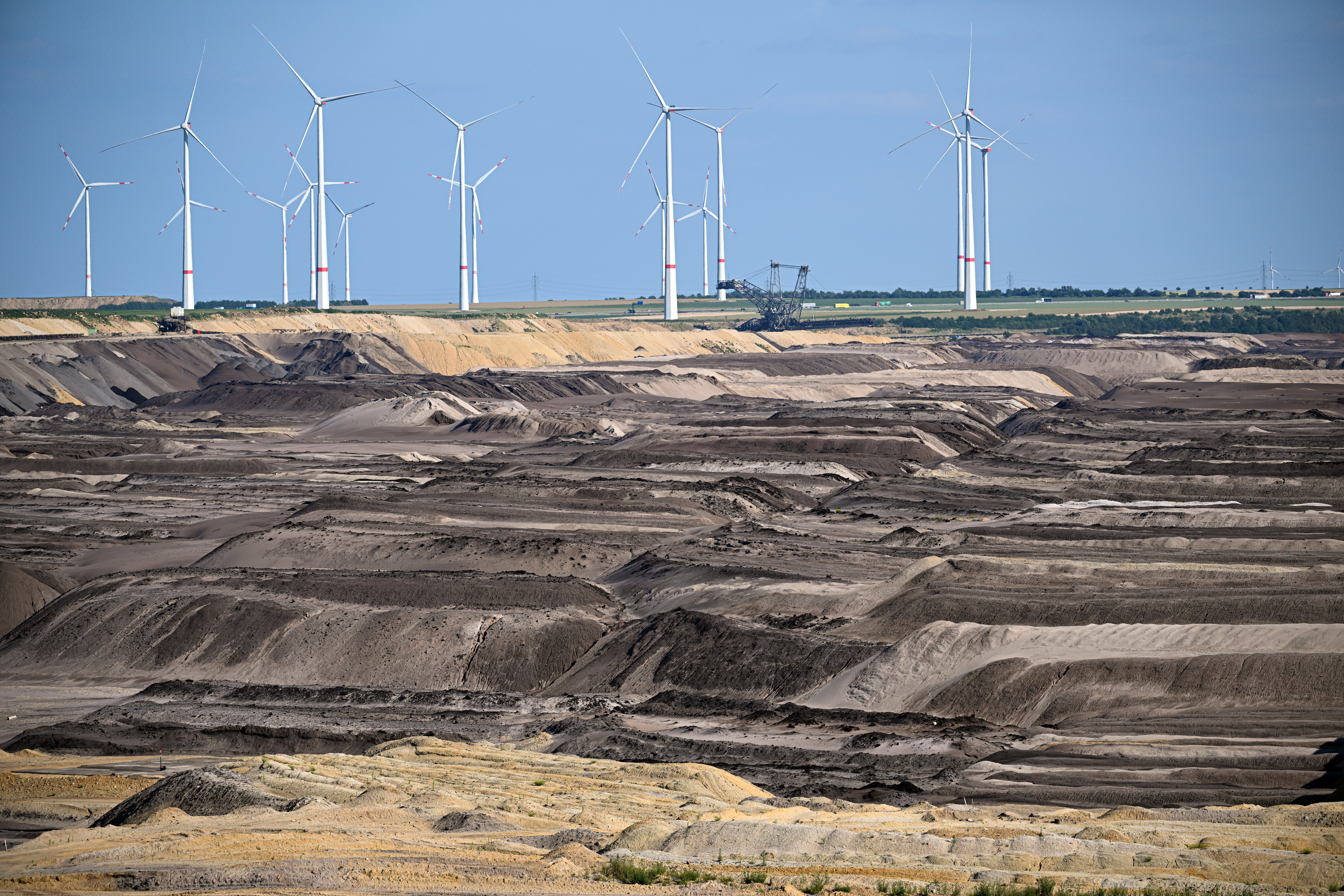 Wind turbines tower over the Garzweiler coal mine in western Germany.