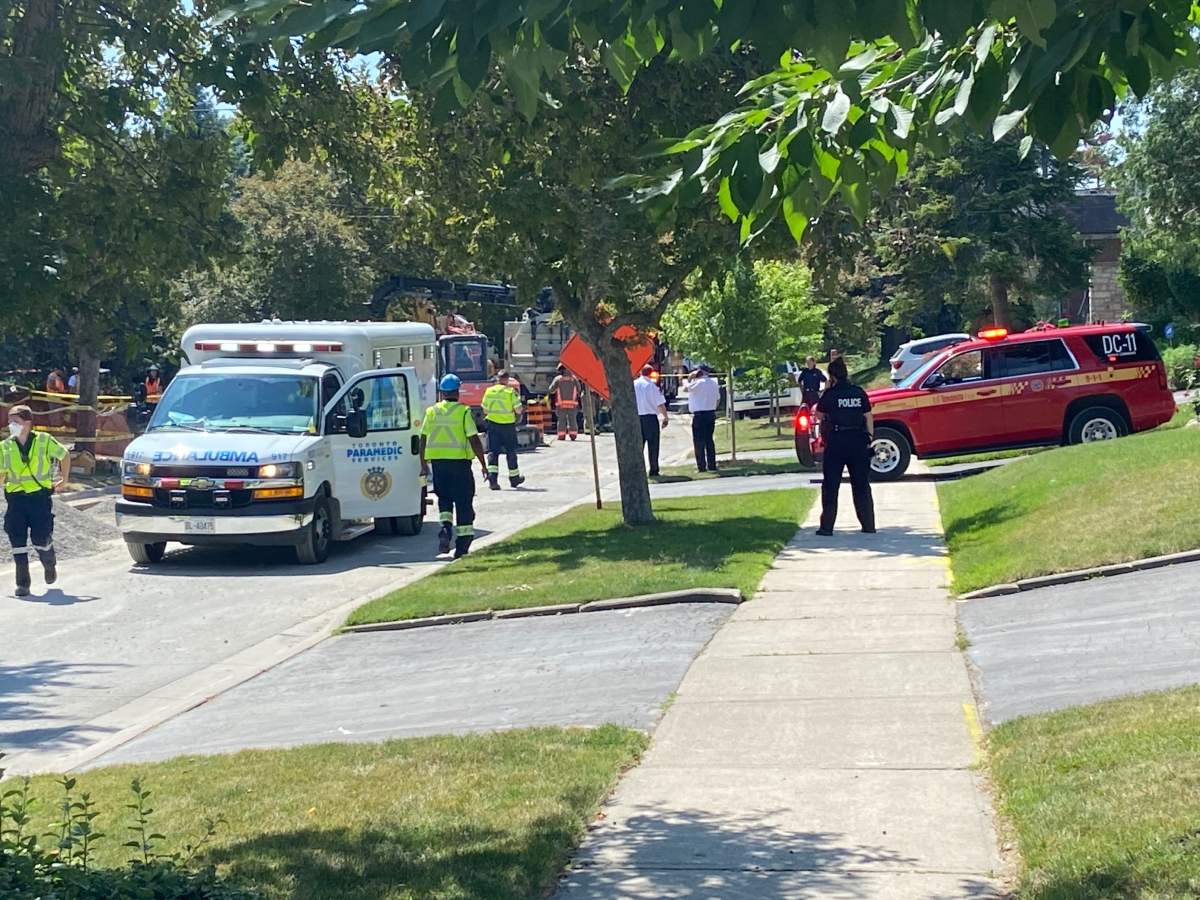 Emergency crews on scene following a trench collapse on Warlock Crescent in Toronto on July 11, 2022.