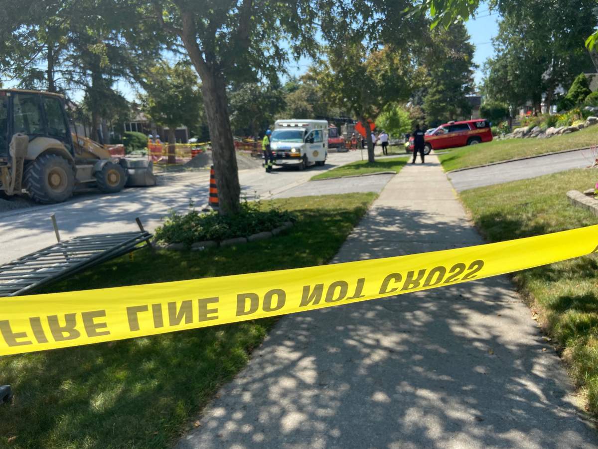 Emergency crews on scene following a trench collapse on Warlock Crescent in Toronto on July 11, 2022.