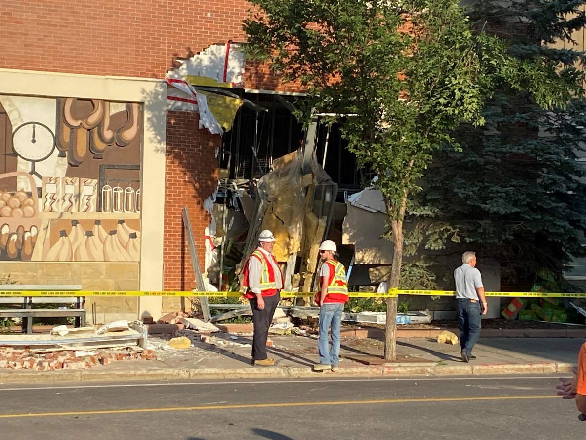A truck was removed from a Calgary building after slamming into it on Thursday, Aug. 18, 2022.