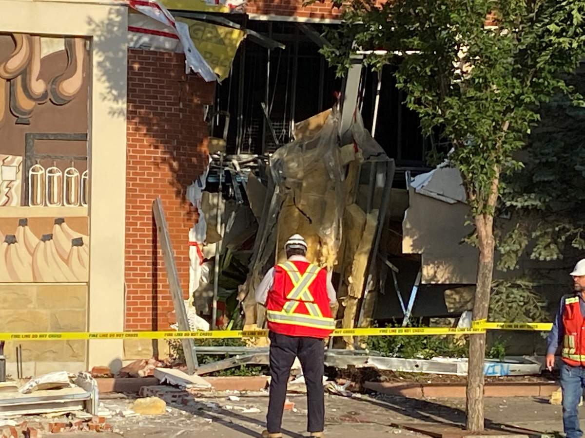 A truck was removed from a Calgary building after slamming into it on Thursday, Aug. 18, 2022.