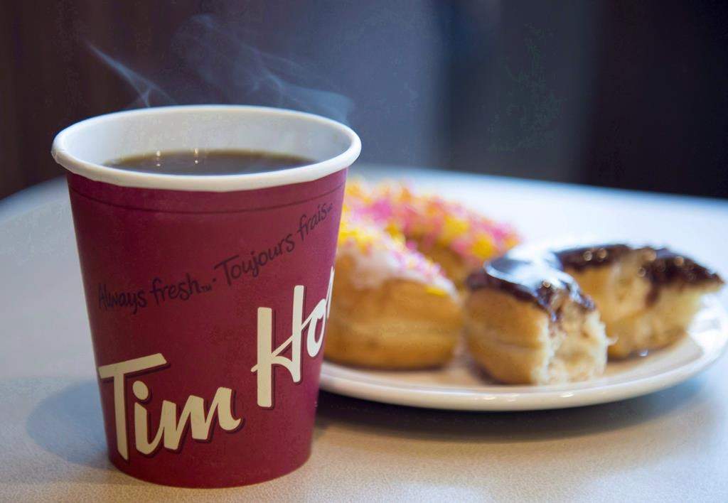 A coffee and doughnuts from Tim Hortons are seen at a Coquitlam, B.C., location on April 26, 2018.