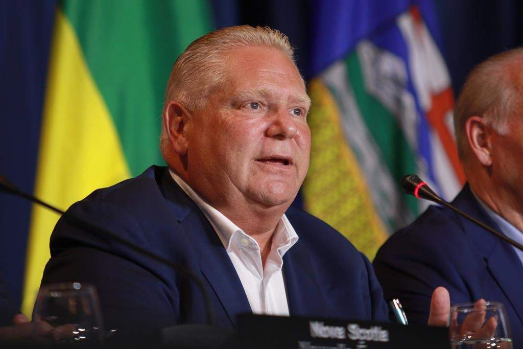 Premier Doug Ford responds to a question from the media on the final day of the summer meeting of the Canada's Premiers in Victoria, B.C., on Tuesday, July 12, 2022. THE CANADIAN PRESS/Chad Hipolito.