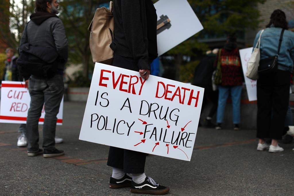 FILE. Moms Stop the Harm advocates and supporters gather at Centennial Square on the sixth anniversary of a public health emergency due to the opioid-related deaths across British Columbia, in Victoria on April 14, 2022. B.C. says it has suffered more than 10,000 overdose deaths since the province declared a public health emergency in April 2016. 