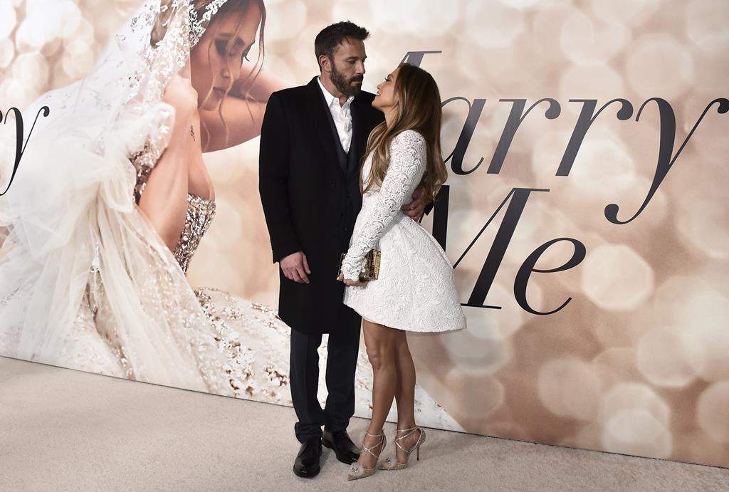 Cast member Jennifer Lopez, right, and Ben Affleck attend a photo call for a special screening of "Marry Me" at DGA Theater on Feb. 8, 2022, in Los Angeles.