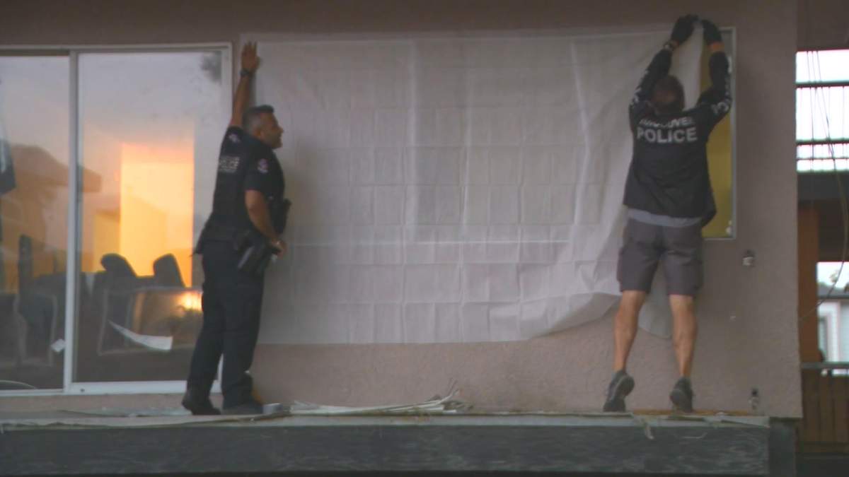 Vancouver police officers were seen investigating an apartment after they arrested a wanted man.