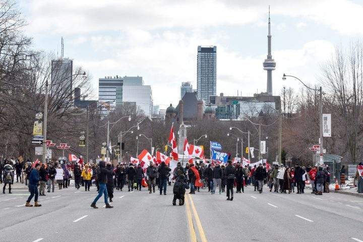 Anti-mandate protesters, also known as Freedom Convoy, took to the street in downtown Toronto to protest vaccine mandates in Toronto, Ontario, February 12, 2022. 