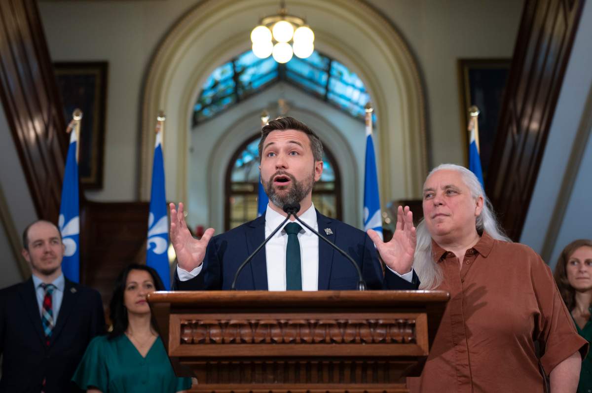 Quebec Solidaire Leader Gabriel Nadeau-Dubois gives an appraisal of the session at a news conference, Friday, June 10, 2022 at the legislature in Quebec City. Quebec Solidaire MNA Manon Masse, right, looks on. Quebecers will go to the polls for a general election on Oct. 3. THE CANADIAN PRESS/Jacques Boissinot