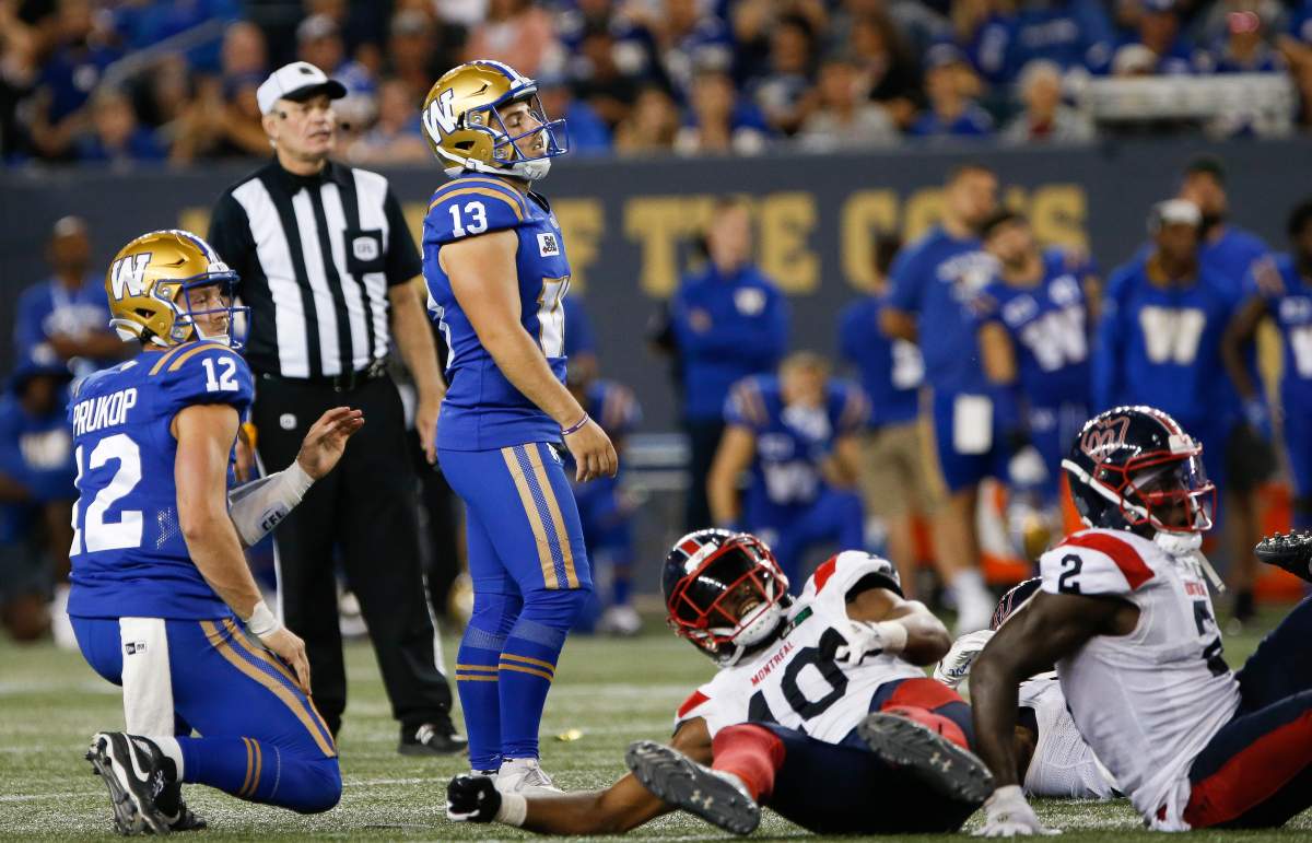 Winnipeg Blue Bombers kicker Marc Liegghio (13) reacts as he watches his field goal attempt go wide during overtime of CFL action against the Montreal Alouettes in Winnipeg Thursday, Aug. 11, 2022.