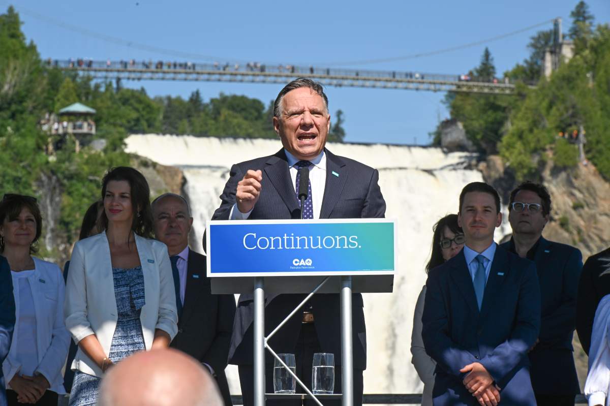 Coalition Avenir Quebec Leader Francois Legault, centre, launches his campaign at the Montmorency Falls with candidates, Sunday, August 28, 2022 in Quebec City. Quebecers are going to the polls for a general election on Oct. 3. THE CANADIAN PRESS/Jacques Boissinot