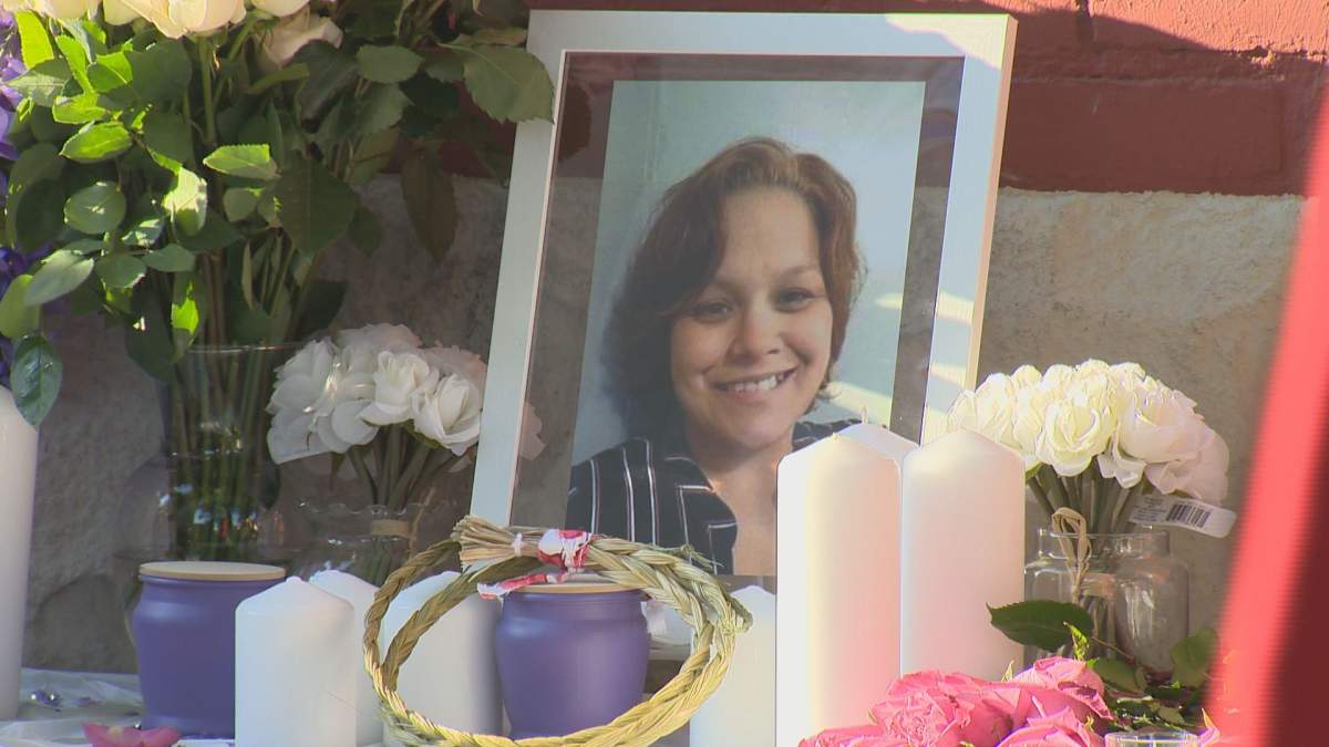 Dozens gathered outside the Jarvis Avenue apartment building Saturday evening where Danielle Ballantyne died, to pay tribute to the 36-year-old mother of four, remembered for her big heart and contagious smile.