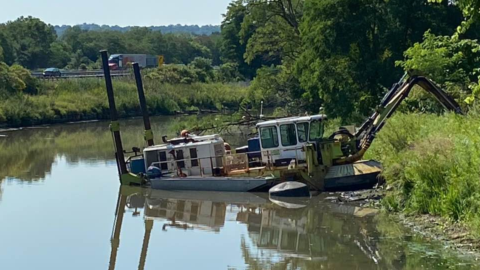 A dredging boat in Chedoke Creek near Kay Drage Park in Hamilton.