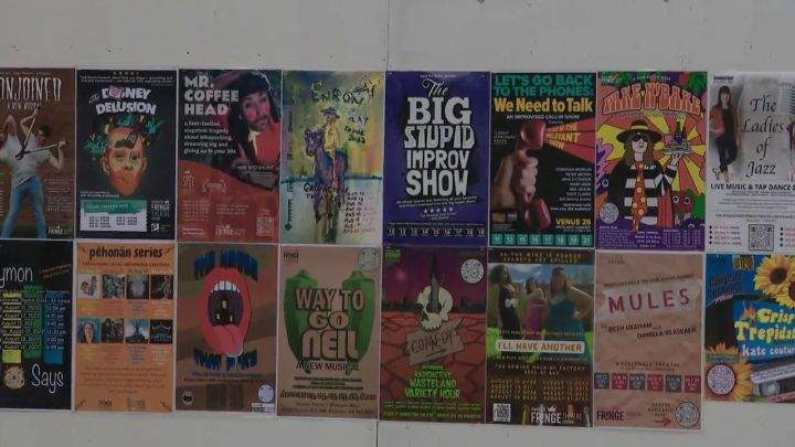 A wall of posters for shows being performed at the 2022 edition of the Edmonton International Fringe Theatre Festival.