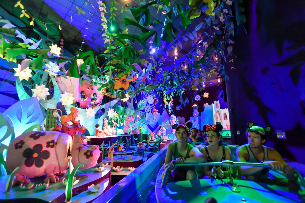 Lara Insko, left, Rachael Keniry, center, and Trevor Hoffman ride, “it’s a small world” in Fantasyland at Disneyland in Anaheim, California, on Wednesday, June 28, 2017.