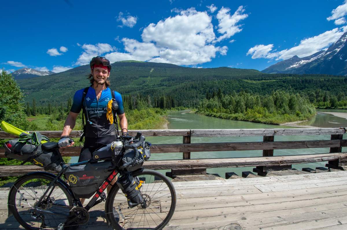 Lambert poses for a photo while on his fundraising cycling tour across Canada.