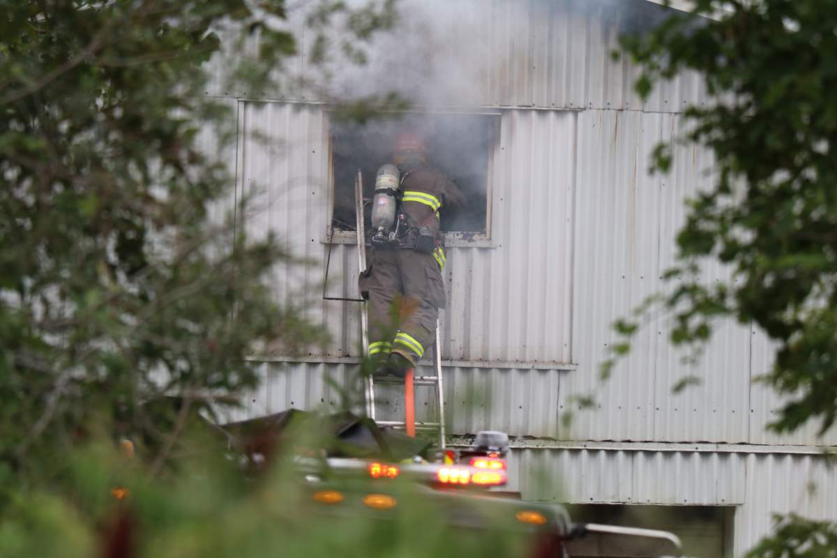 Firefighters in Trent Hills battle a fire on Concession Road 3 West on Aug. 9, 2022.