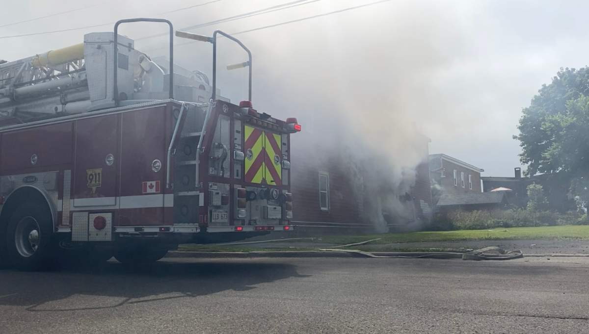 Smoke pours out of an empty home in Saint John’s Old North End.