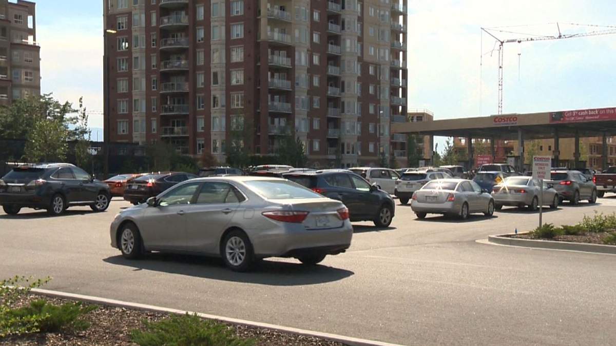 Vehicles lined up on Thursday at a gas station in Kelowna. The city says starting July 25, residents or visitors are no longer permitted to have their vehicle idle for more than a minute, though there are exceptions, like being stuck in traffic.
