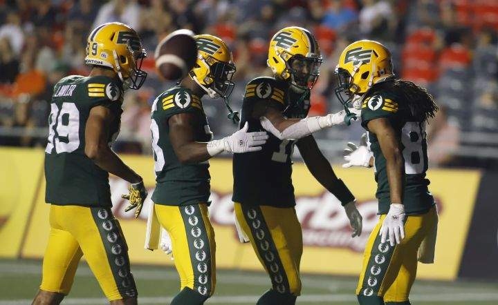 Edmonton Elks’ Derel Walker (87), right, celebrates his touchdown with teammates, Kenny Lawler (89), Chris Osei-Kusi (18), and Kai Locksley (10) during second half CFL action against the Ottawa Redblacks in Ottawa on Friday, August 19, 2022.