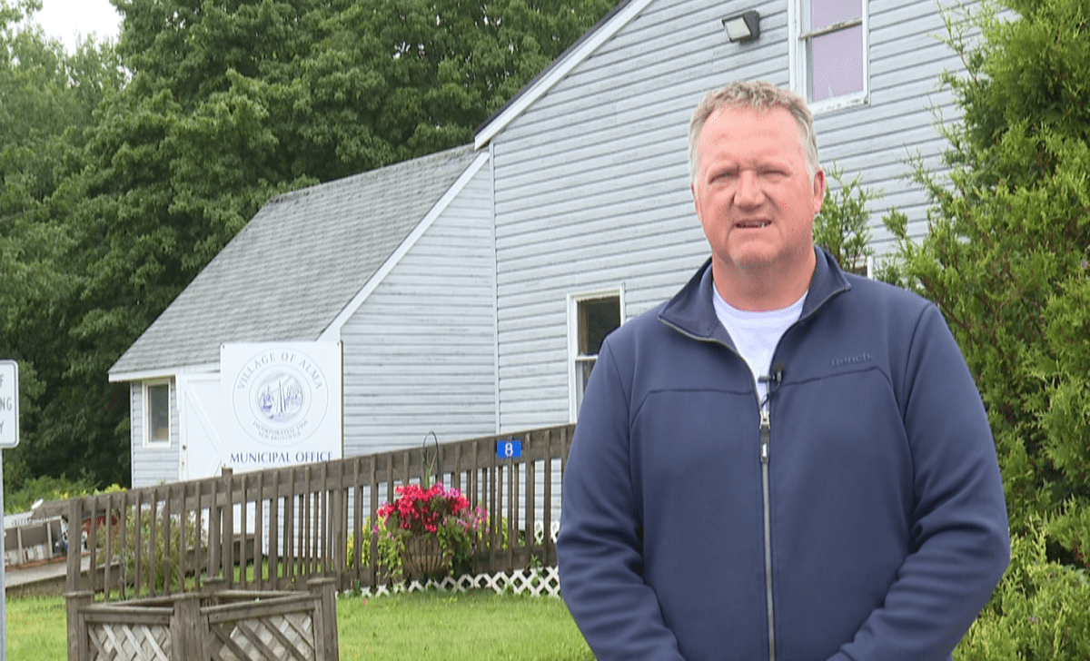 Alma mayor Andrew Casey stands in front of the village office