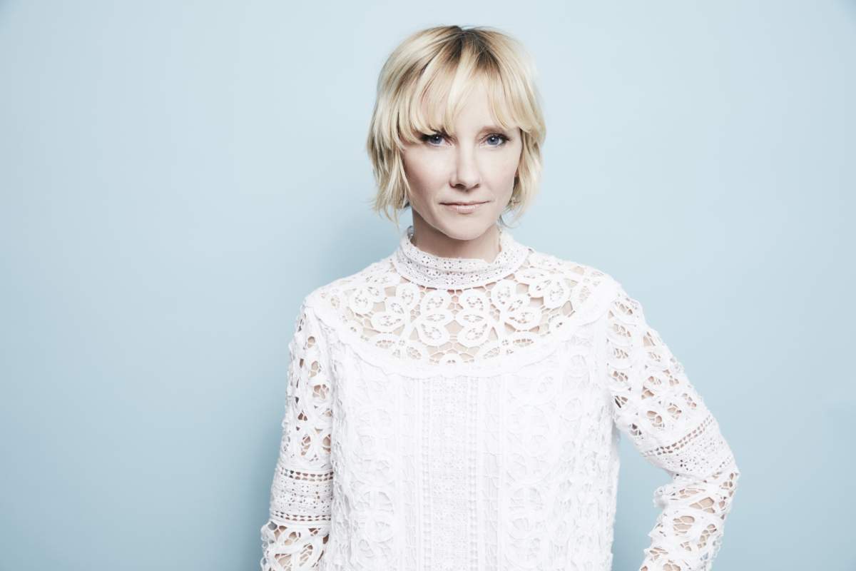 Anne Heche in a white shirt.