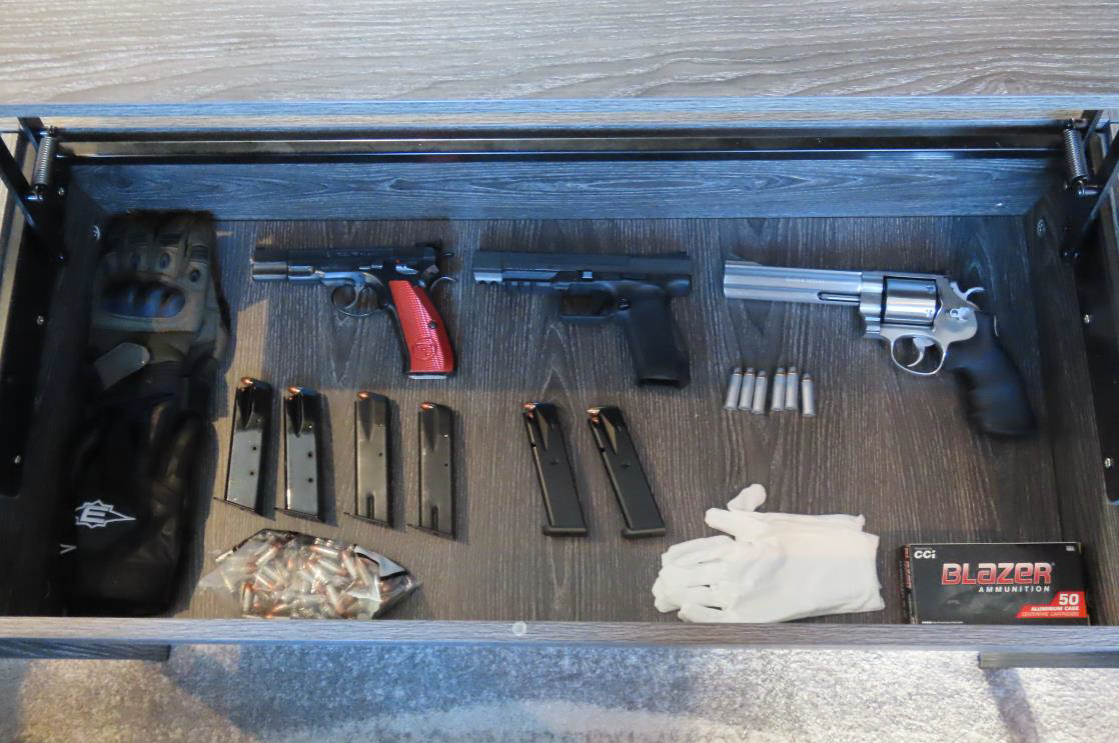 A photo of the guns and ammunition seized by Calgary police officers after they conducted a search warrant in two residences on Tuesday, Aug. 30.