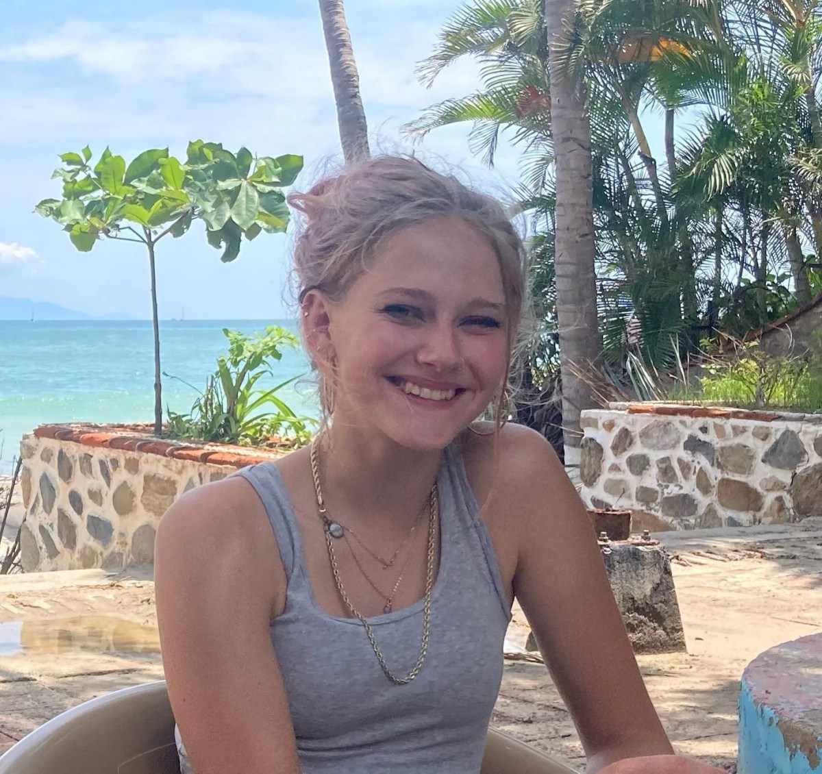 Kiely Rodni smiling on a beach.