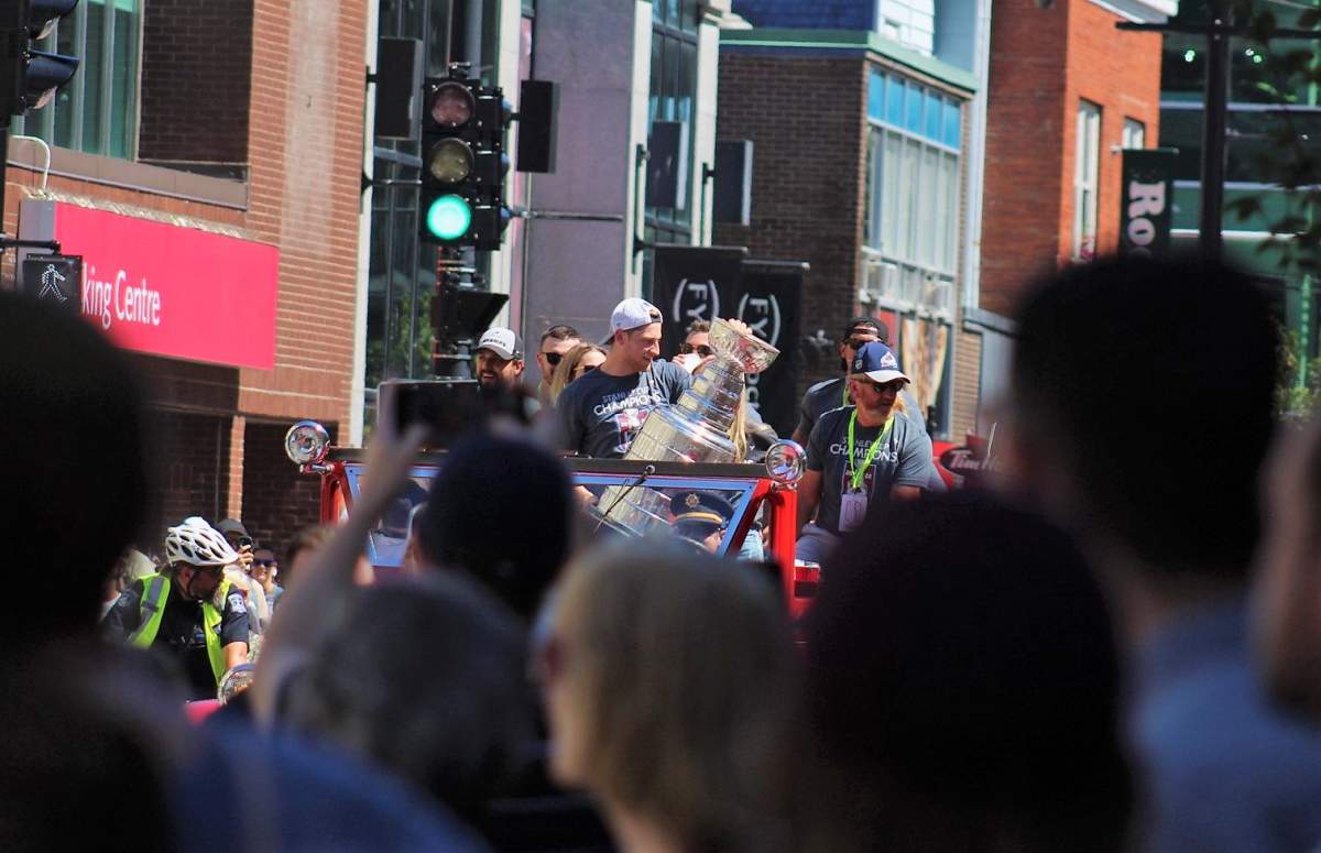 Nathan MacKinnon holds the Stanley Cup during a parade in downtown Halifax.