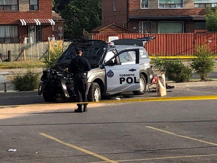 A crashed Toronto police cruiser is seen near Keele Street and Lawrence Avenue.